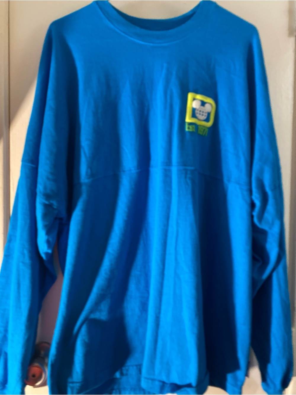 Disney Bright Blue Long-Sleeve Sweatshirt with Lime Patch